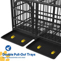 Black metal pet crate with two pull-out cleaning trays attached, shown on a white background with text reading 'Double Pull-Out Trays' and a blue cleaning brush icon.