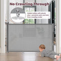 A gray mesh baby safety gate installed across a doorway, with a baby crawling underneath. The image includes marketing text reading 'No Crawling-Through' and 'Added safety with plastic disc—prevents pets and kids from crawling under,' plus a circular inset showing the plastic disc detail.